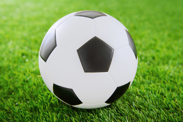 Fototapeta na wymiar Soccer ball on green turf