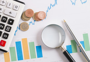 calculator on the rising graphic with coin