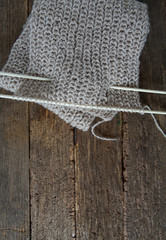 grey scarf on wooden surface