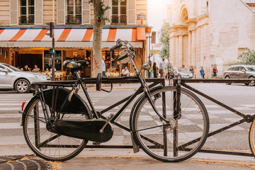 Fototapeta na wymiar Old bicycle parked on Boulevard Saint-Germain in Paris, France
