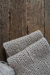 grey scarf on wooden surface