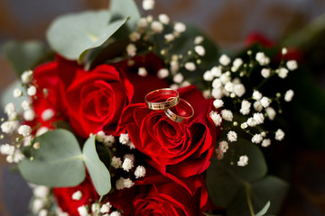 Wedding rings on the bouquet. morning bride