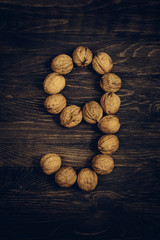 number nine nuts on wooden background