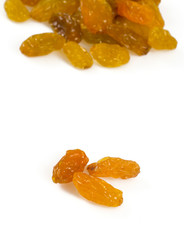 yellow raisins isolated on whtie