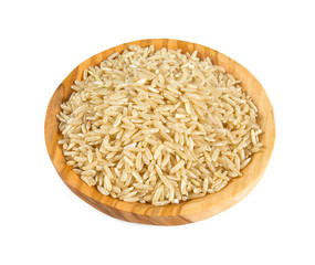 brown rice in a olive wood bowl isolated on white