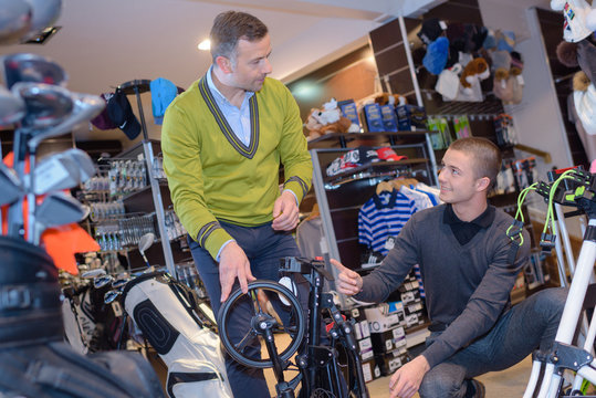 seller and client in golf club store