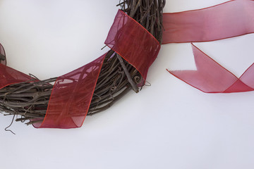 Wooden Vine Wreath with a Red Ribbon - Powered by Adobe