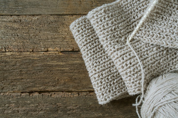 piece of knitting on wooden sirface