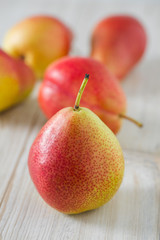 beautiful ripe pears on wooden surface