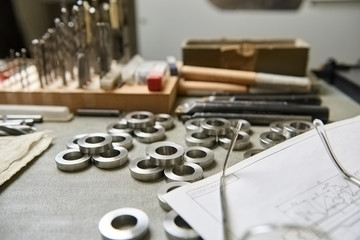 Steel washers on the table. Neatly arranged steel washers.