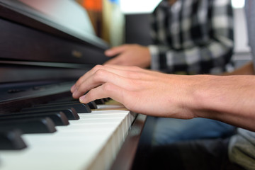 pressing a piano
