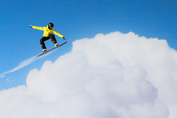 Naklejka na ściany i meble Snowboarder making jump