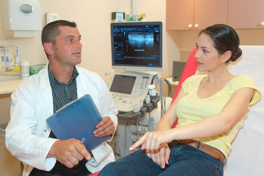 doctor in consultation with female patient