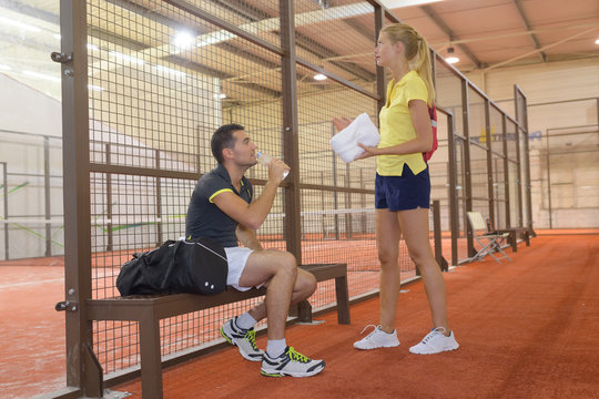 couple of tennis players talking after a match