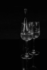 Two glasses and a bottle of white wine