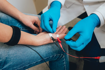 Patient nerves testing using electromyography. EMG