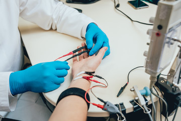 Patient nerves testing using electromyography. EMG