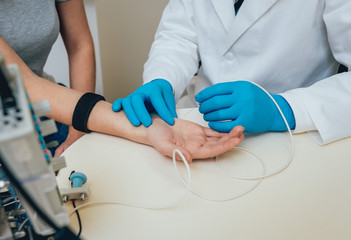 Patient nerves testing using electromyography. EMG