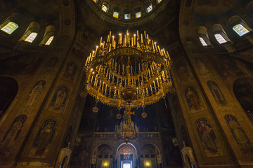 Fototapeta na wymiar Big ornate chandelier in Alexander Nevski cathedral, Sofia, Bulgaria