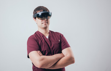 Doctor uses augmented reality goggles.