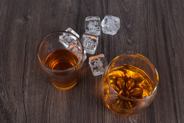 two whisky on the rock on wood and wood background