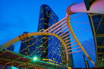 Chong Nonsi skywalk in the night, Business district with high building. Bridge link between mrt and bts mass transportation in heart of Bangkok, Thailand
