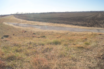 Fototapeta na wymiar Plowed Field Road