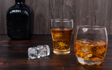 two whisky on the rock on wood and wood background