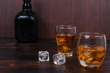 two whisky on the rock on wood and wood background