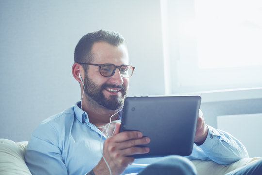 businessman with digital tablet and earphones