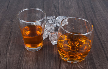 two whisky on the rock on wood and wood background