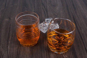 two whisky on the rock on wood and wood background