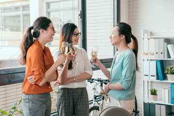 Group of people drinking champagne and talking