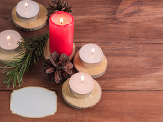 Background of candles of spruce branches and greeting text