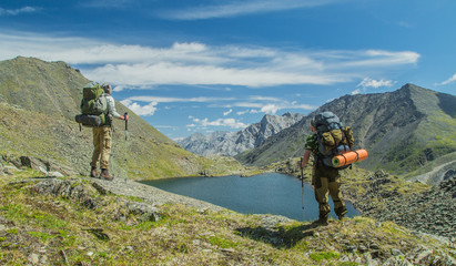 Obraz premium Men hiking in mountains. Siberia.