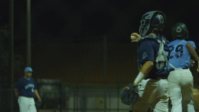 Great slow motion shot of a batter running to first base during a baseball game