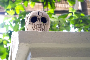 White skull made of clay as decoration at mexican Day of the Dead celebration in Oaxaca, Mexico