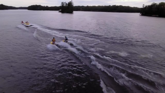 following a motorboat pulling waterboarders on lake McKellar
GRADED FOOTAGE