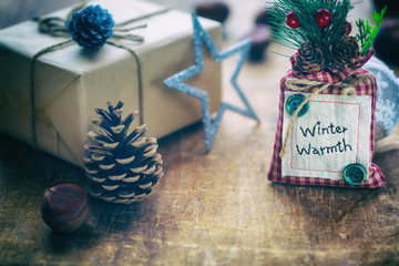 Christmas Composition with present box festive decorations on wooden background