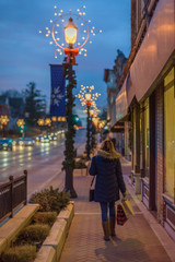 woman walkiing outside Christmas shopping