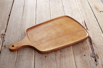 Wood cutting board on wooden background