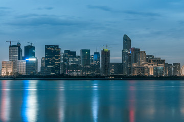 Fototapeta na wymiar night view of modern city waterfront downtown skyline,China..