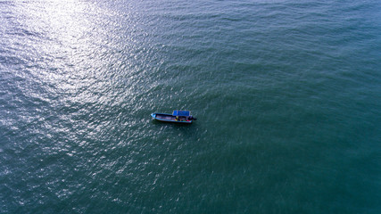A Small boat in the Vast Sea