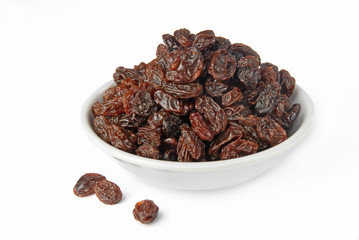 Black raisins on a white background         