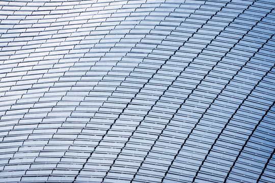 Top view of a building roof fully covered with solar panels
