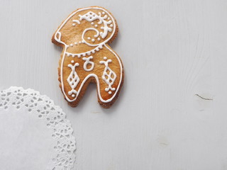 Homemade Christmas sugar cookies glazed with royal icing. Christmas biscuits in the shape of sheep. Food background.