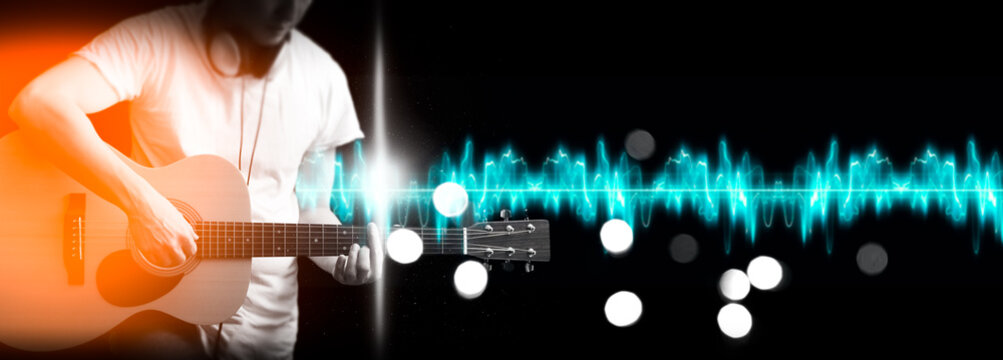 male musician playing guitar. live music & studio recording, music background