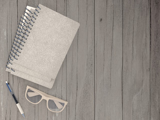 Notebook with pen and spectacles