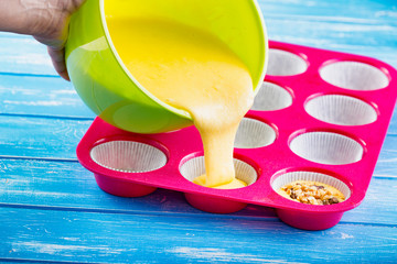 Pouring cake into silicone mold