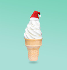 Santa Claus red hat on real soft serve vanilla ice cream in crispy wafer cone isolated on green background (Clipping path included) to celebrate Christmas holiday season or special new year party